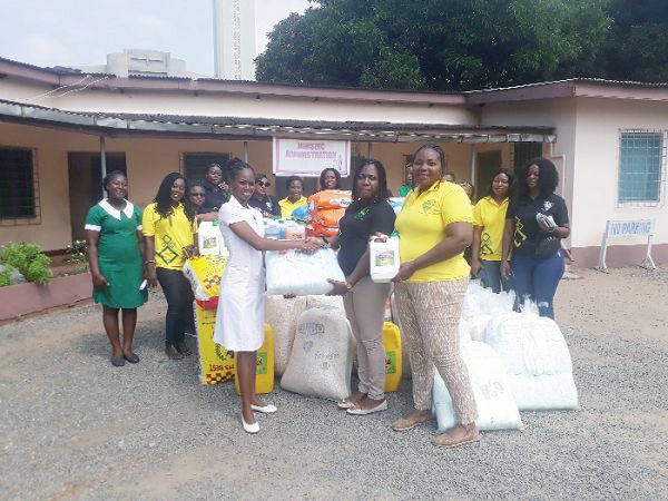 Ms Grace Ofosu-Donkor (2nd right) presenting the items to Ms Makafui Agbeko
