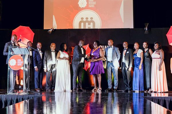  Mr Richard Abbey Jnr, Event Director of Xodus Communications, presenting the Private Health Insurance Company of the Year award to NMH Nationwide Insurance Company