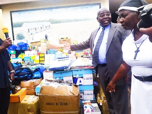 Retired teacher donates to Bishop John Daly School