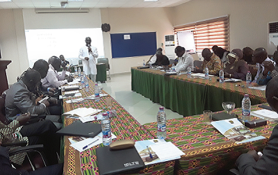 Prof. Mohammed Salifu (with microphone) addressing the participants. Arrowed is Prof. Kwesi Yankah
