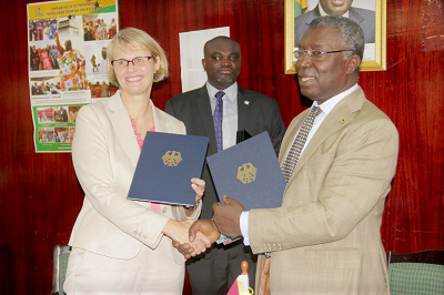  Prof. Kwabena Frimpong-Boateng (right) and Ms Anja Karliczek (left) exchanging documents after signing the agreement.Picture: EDNA ADU-SERWAA