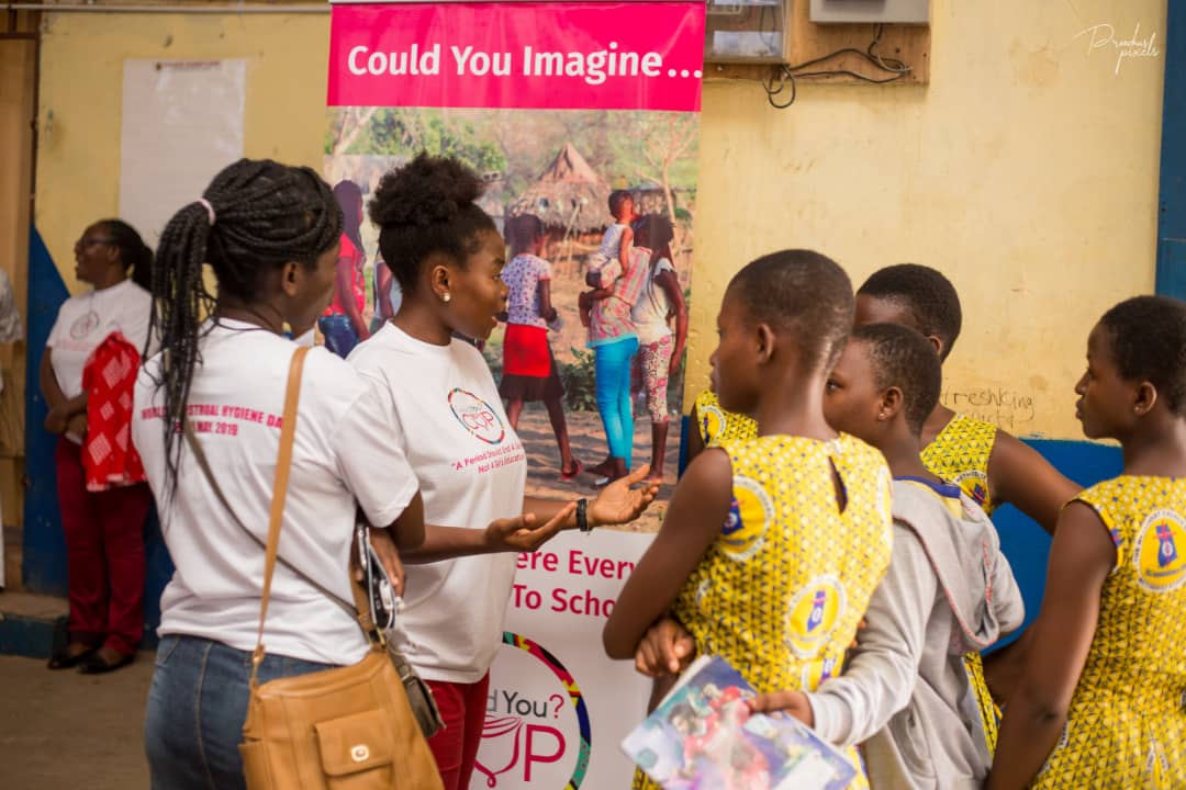 The project manager, Madam Anna Sefakor Dotse interacting with some pupils of the Boundary Road Cluster of schools