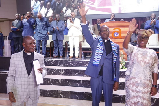 Apostle Peter Okoe Mankralo (left), Immediate Past President introducing Apostle Dr. Aaron Ami-Narh and his wife Deaconess Josephine Ami-Narh to the church.