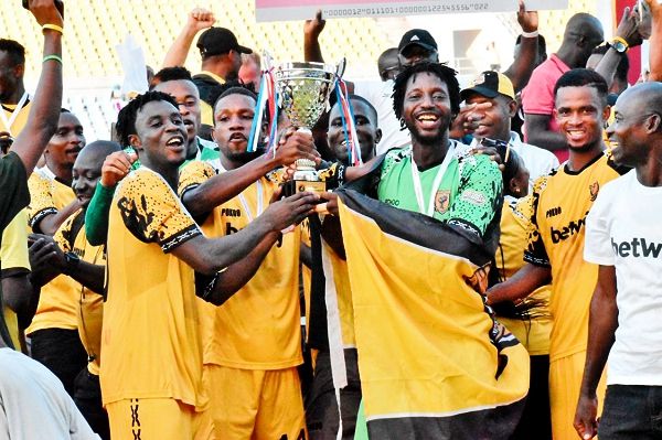 Players of Ashantigold celebrating with the winner’s trophy yesterday.Picture: Dada Oliseh Photos