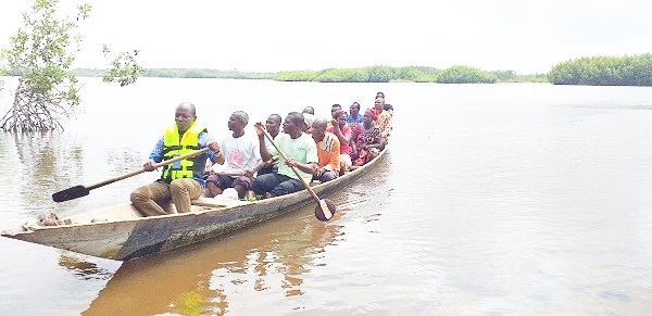 Some teachers crossing the river to school