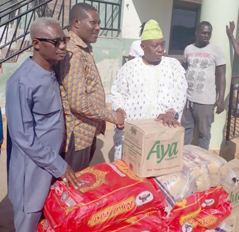 Alhaji Abdul Latif Abdul Salaam, the Protocol Officer of the Chief Imam, receiving the items from Mr Boye Laryea on behalf of the Chief Imam