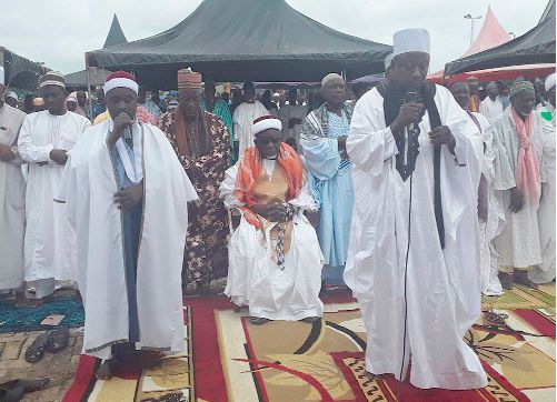 Alhaji Seidu Mahamudu leading the Muslims in prayers in Sunyani, with Alhaji Abdul Kadir, Bono Regional Chief Imam, seated behind him