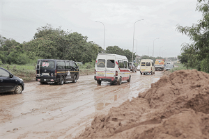 Vehicles moving freely after the mud has been cleared from the road. Picture: EMMANUEL ASAMOAH ADDAI
