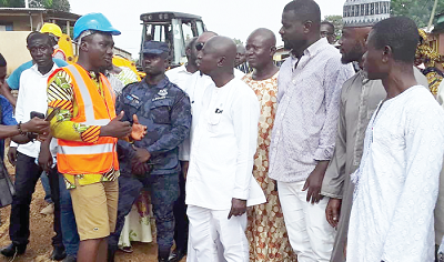 Mr George Yaw Sarpon (left), the Project Engineer of Prompto Logistics, explaining a point to Messrs Samuel Atta Akyea and Frank Annoh-Dompreh