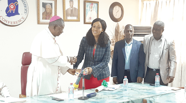 Mrs Jean Mensa (2nd left) presenting a copy of the EC’s calendar of activities to Bishop Philip Naameh. Looking on are the two deputy commissioners, Dr Eric Asare (right) and Mr Samuel Tettey 