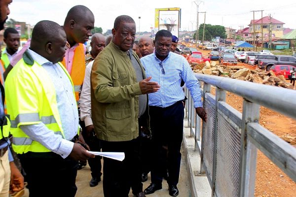 Mr Kwasi Amoako-Atta (2nd right) inspecting progress of work on the Madina Firestone footbridge. Looking on include Dr Barima Nana Yaw Kissi (left), Mr Kwaku Atakora (2nd left), Bridge Engineer on the project, and other officials of the Ghana Highway Authority. Picture: Maxwell Ocloo