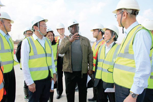 Mr Amoako-Atta (middle with hand raised) explaining a point to Mr Sujan Chinoy  (2nd left), the Japanese Minister of Infrastructure, when the two inspected work on the Tema Motorway rounabout road project. Picture: DELLA RUSSEL OCLOO
