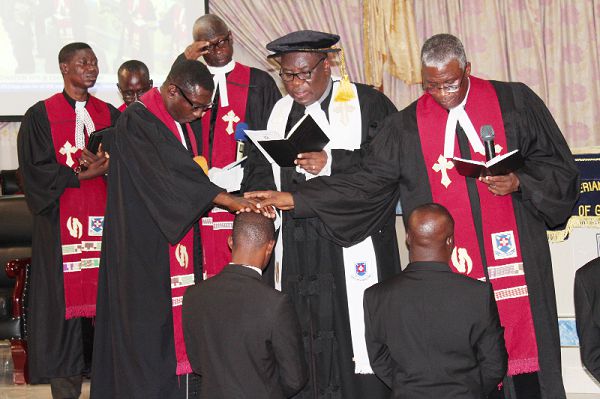 Rt Rev. Prof. Mante and some Presbytery chairpersons praying  for the the ordinands
