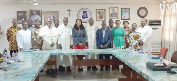 The Chairperson of the EC, Mrs Jean Mensa (4th from right) and other staff of the EC  with the leadership of the Catholic Bishops’ Conference