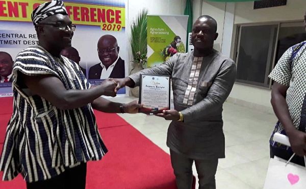  Mr Benyi (right)being awarded by CEDECOM. Presenting the award to him is Dr Kodjo Mensah Abrampa, the Chairman of CEDECOM's Board of Directors