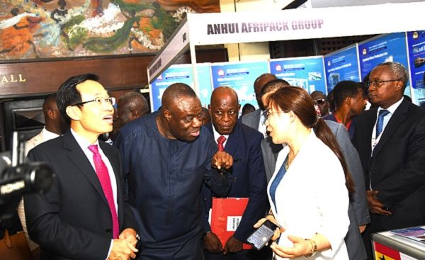 Mr Mohammed Ibrahim Awal (2nd left) interacting with Ms Suin Wong, Marketing Manager of Shandong Guanxian Rongda Composite Material Company Limited during the inspection of an exhibition mounted as part of the conference. On the left is Mr Shi Ting Wang, the Chinese Ambassador to Ghana Picture: EBOW HANSON