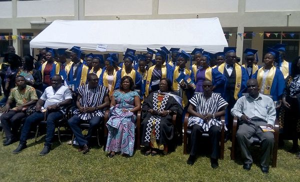 The graduates with dignitaries after the ceremony