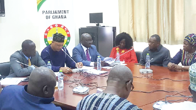 Mr Adam Mutawakilu (in hat) making a point at the press conference