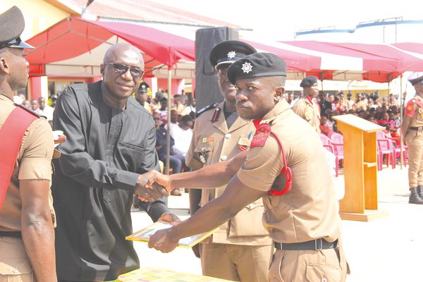   Mr Ambrose Dery (left), presenting the Overall Best Recruit Award to RFW Alex Eduonoo at the event. Picture: EDNA ADU-SERWAA