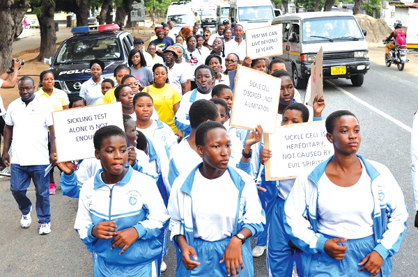 Some participants walking through some principal streets of Accra with placards. Picture: NII MARTEY M. BOTCHWAY