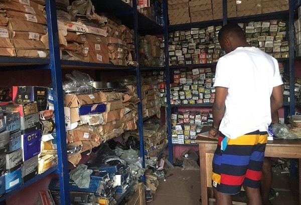 A worker at Sunka Investment Limited, one of the Nigerian spare parts shops at the Suame Magazine in Kumasi, plying his trade.