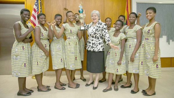 The 2019 Robofest Champions from the Methodist Girls’ Senior High School at Mamfe presenting the trophy to Ambassador Stephanie S. Sullivan