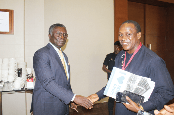 Prof. Kwabena Frimpong-Boateng (left), Minister of Environment, Science, Technology and Innovation, shaking hands with Dr Kandeh Yumkella (right), an Advisor to the International Energy Agency on Africa. 