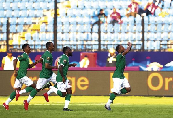 Players of Madagascar join Marco Ilaimaharita (right) to celebrate his goal against Burundi 
