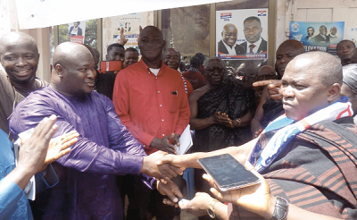 Mr Awudu Issaka (left) thanking Mr Akwasi Acquah after receiving the keys to the vehicle.