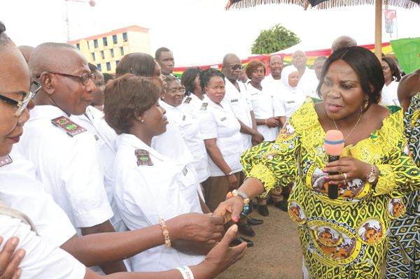  Mrs Cecilia Dapaah exchanging pleasantries with some members of the Sanitation Enforcement Brigade in Kumasi, after its inauguration