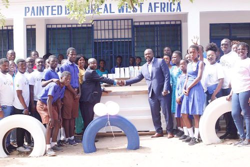 Managing Director L'Orėal West Africa, Mr Sekou Coulibaly (right), handing over the items to Mr Isaac Arthur, the headmaster of the Tetteh-Ocloo State School for the Deaf.  Picture: BENJAMIN XORNAM GLOVER