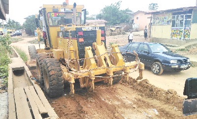 A grader working on a portion of the Omanjor road at the time of the visit
