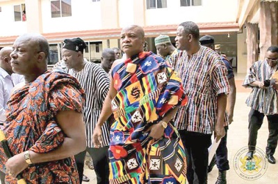 Togbe Afede XIV (2nd right), followed by Mr Kofi Dzamesi, (right) and Mr Salifu Saeed, the Northern Regional Minister, on their way to the meeting