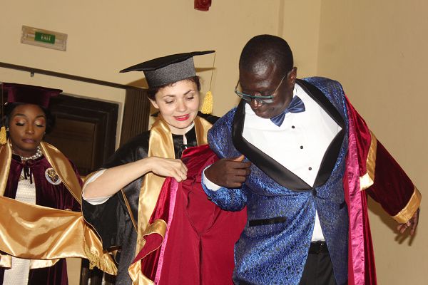 Dr Mishustina Tetiana (left), Vice-Rector for Strategic Development and Communication, Alfred Nobel University, decorating Dr Samuel Ato Duncan, during his professorial induction