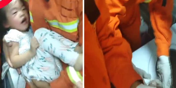 Dramatic rescue sees girl lifted out by her feet after getting stuck in washing machine