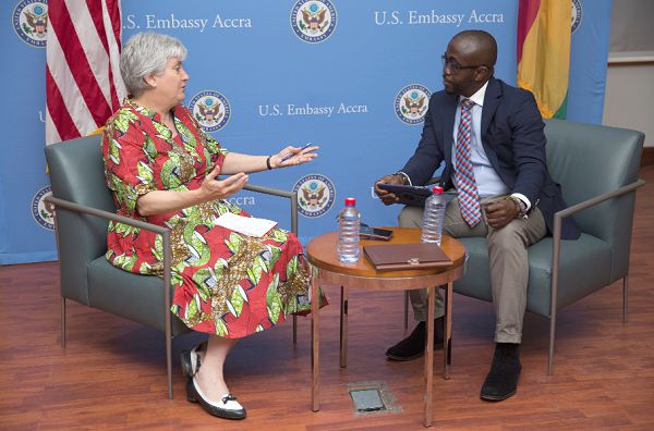 Ms Stephanie S. Sullivan, US Ambassador to Ghana, answering questions during an interview with Mr Charles Benoni Okine, Assistant Editor,  Graphic Business
