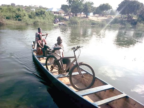 Some of the residents crossing over the river to the next town