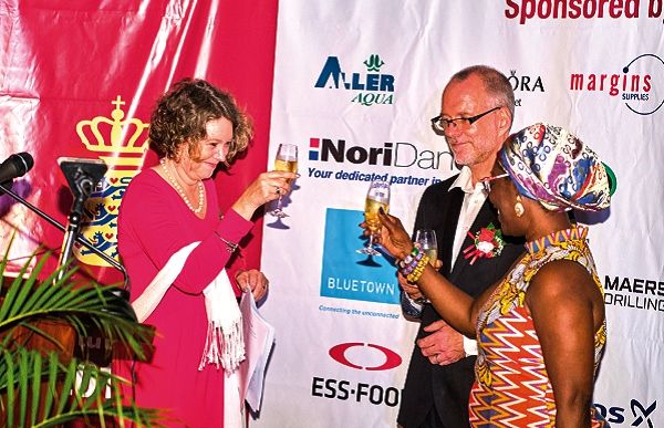Mrs Tove Degnbol proposes the toast, while her husband, Mr Lars Udsholt and Mrs Ursula Owusu-Ekuful respond.