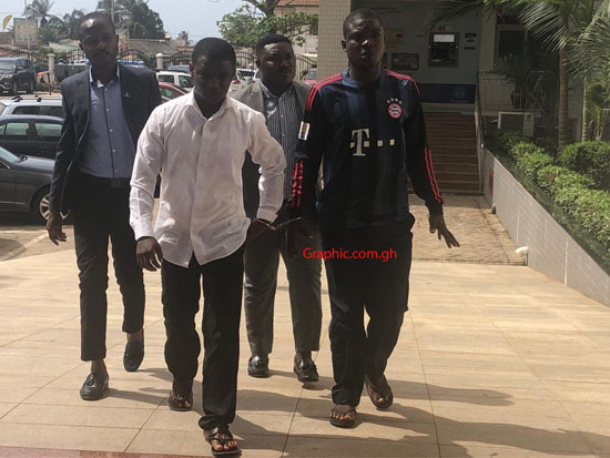 Daniel Asiedu (white shirt) and Vincent Bosso arriving in court on Thursday. PICTURE BY EMMANUEL EBO HAWKSON