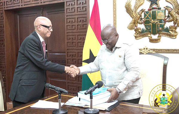 Justice Emile Short presenting the report on the Ayawaso bye-election violence to President Akufo-Addo