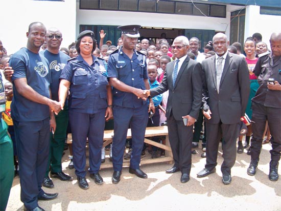Pastor Mark Hardo (2nd right) exchanging pleasantries with Superintendent Douglas Kumah