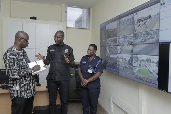 Coporal Sadick Hamidu (middle) briefing Mr Albert Salia (left), Head of Investigative Desk, Daily Graphic, on operations of the Police Emergency Centre at the Police Headquarters. With them is ASP Gladys Asare. Picture: EMMANUEL ASAMOAH ADDAI