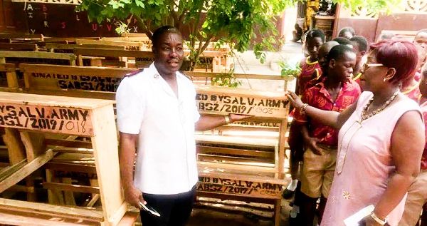 Lt Col. Friday Ayanam (left) presented the dual desks to Ms Denise Dinah Oye Welbeck