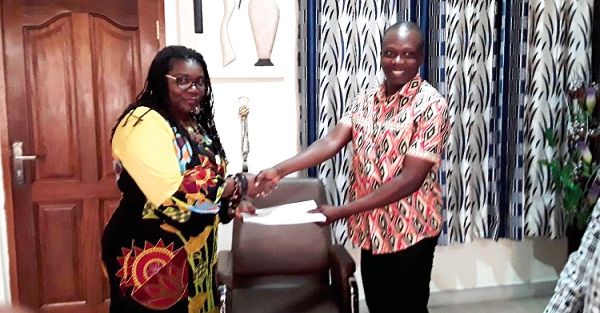 The Executive Director, NVTI, Mrs Mawusi Nudekor Awity, exchanging the signed MoU with Mr John Asibi Ali, the National Director, CAMFED, Ghana.