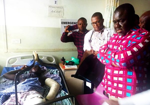  Mr Kwaku Ofori Asiamah (right) commiserating with a victim of the accident at the Trauma and Specialist Hospital in Winneba