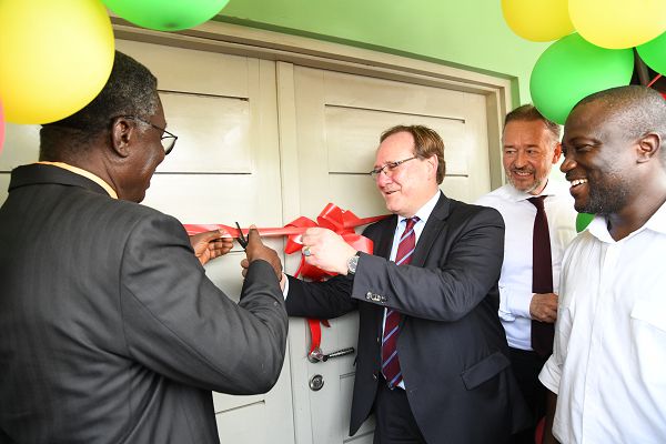 Prof. Kwabena Frimpong-Boateng being assisted by Dr Stefan Oswald (3rd right), an official of the Federal Ministry for Economic Cooperation and Development, to officially inaugurate the training centre. Looking on are Ambassador Christoph Retzlaff and Mohammed Nii Adjei Sowah (right),  MCE of Accra