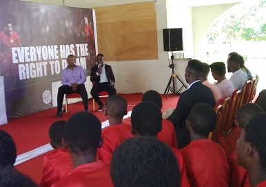 Laryea Kingston (holding microphone) and Tullow MD, Mr Awotwi addressing the students.