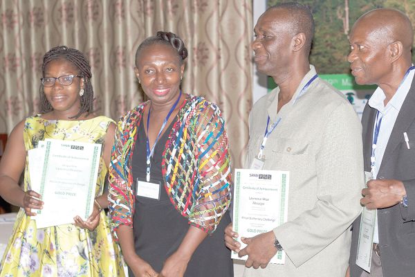Ms Jacqueline Sapoama Mbawine (left), Dr Lawrence Misa Aboagye (2nd right) and Dr Yaw Osei-Owusu, all members of the Ghana team  which won the Gold Prize award with Mrs Levina Owusu (2nd left), Chief Director of Ministry of Environment, Science, Technology and Innovation. Picture:    PATRICK DICKSON  