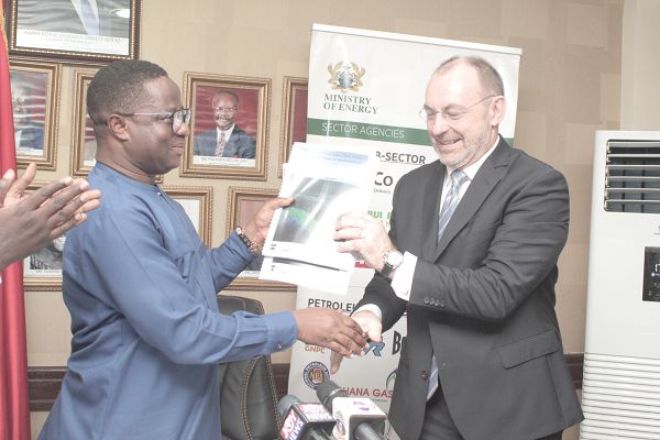 Mr Jan Arve Haugan (right), the Chief Executive Officer of Aker Energy presenting the investment plan to Mr John-Peter Amewu (left), the Minister of Energy at a meeting in Accra. Picture: GABRIEL AHIABOR