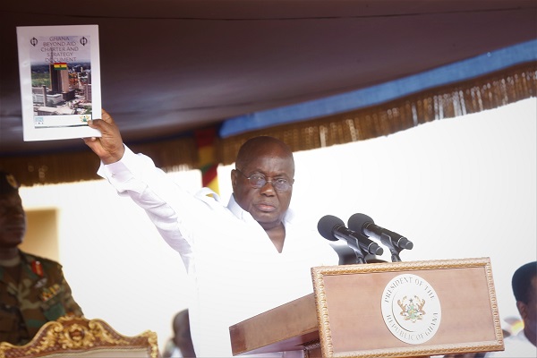 President Nana Addo Dankwa Akufo-Addo displaying the Ghana Beyond Aid document at the May Day celebrations in Accra 